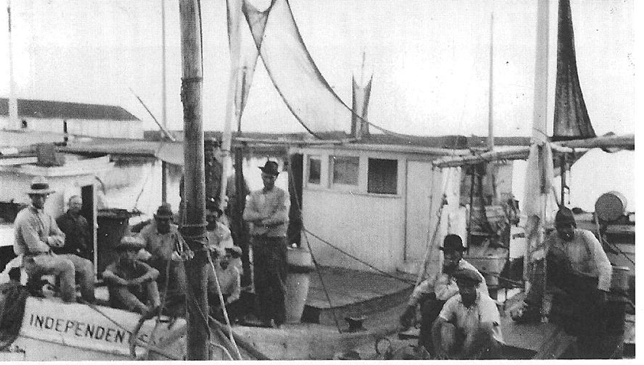 Clessie spent weeks with these shrimpers in the early 1920s to prove to them that he had the better engine for their boats.