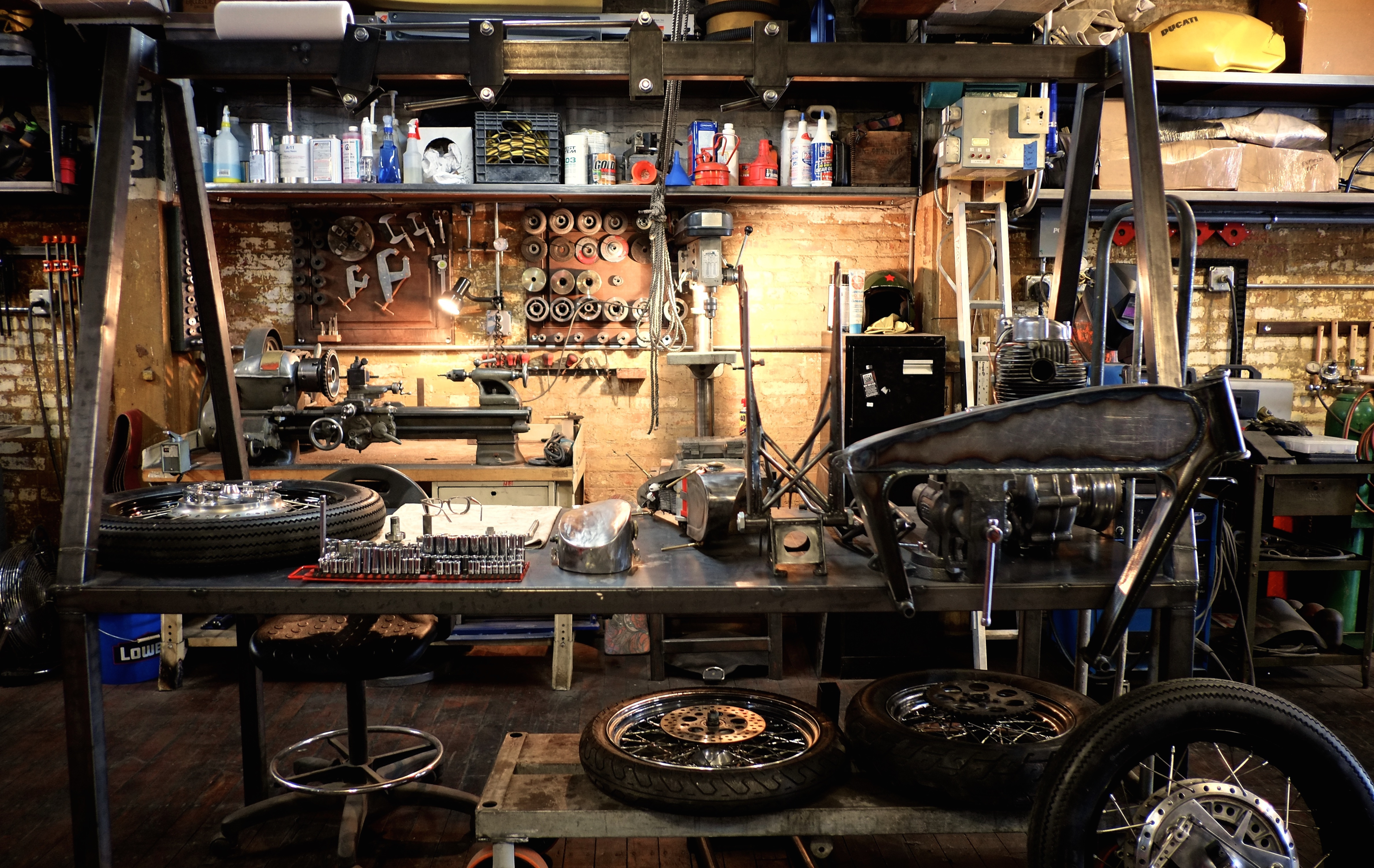 motorcycle parts strewn around a garage